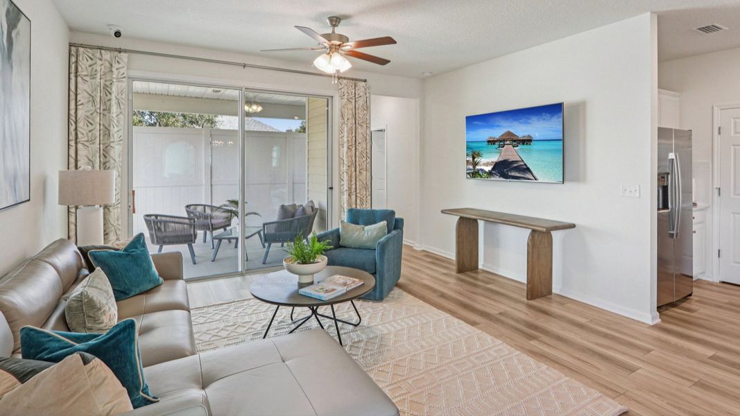 Elegant grey sectional and artful touches create a modern, upscale haven in Panther Creek. Elegant grey sectional and artful touches create a modern, upscale haven in Panther Creek.