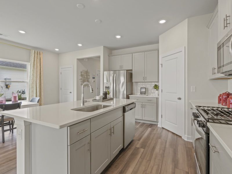 The kitchen overlooks the dining area and great room.