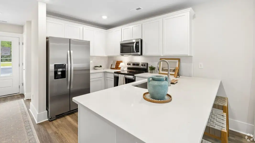 Furnished interior in a model home at The Willows at Blake Farm EXP in Wilmington (Image 7). Furnished interior in a model home at The Willows at Blake Farm EXP in Wilmington (Image 7).