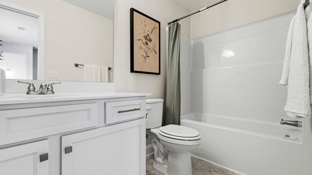 Furnished interior in a model home at Arrowood Acres in Enoree (Image 29).