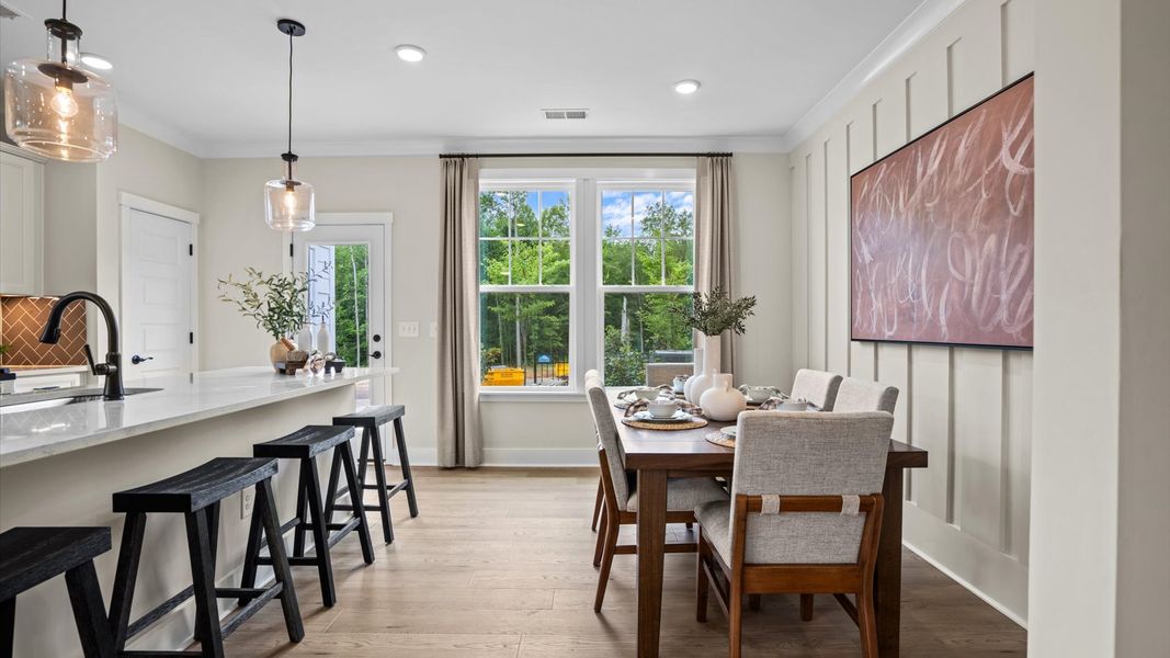 Furnished interior in a model home at North First Street Townes in Mebane (Image 9).
