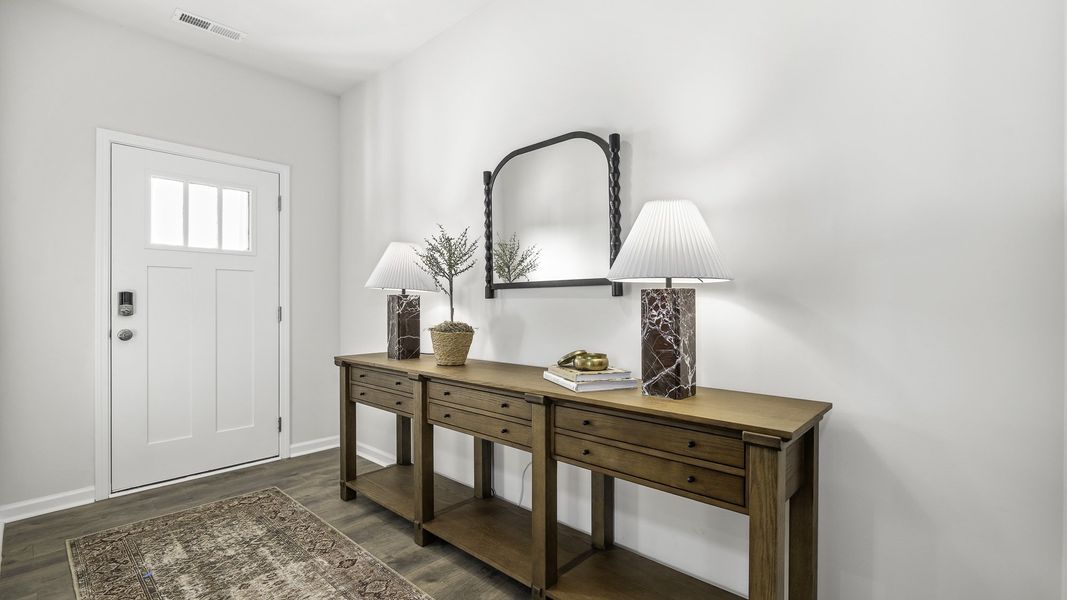 Furnished interior in a model home at Aurora Acres in Snow Camp (Image 4).