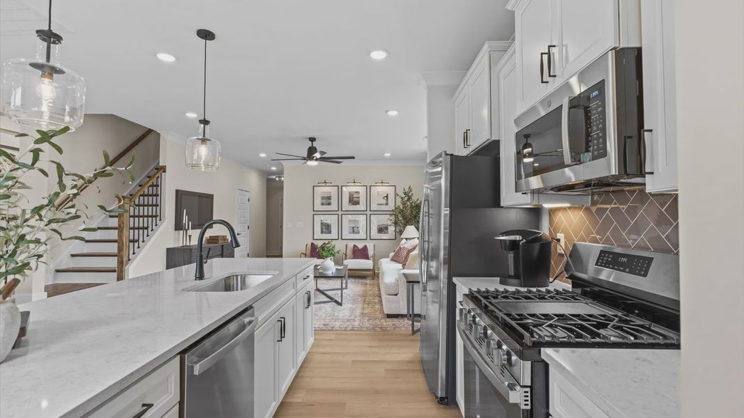 Furnished interior in a model home at North First Street Townes in Mebane (Image 6).