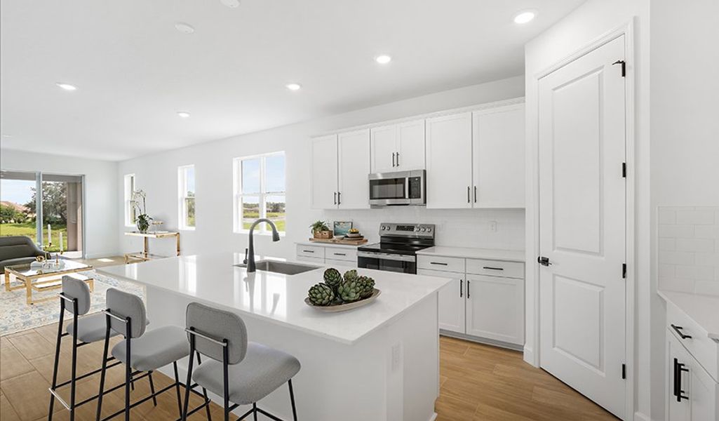 Furnished interior in a model home at Troon Creek Preserve in Leesburg (Image 7).