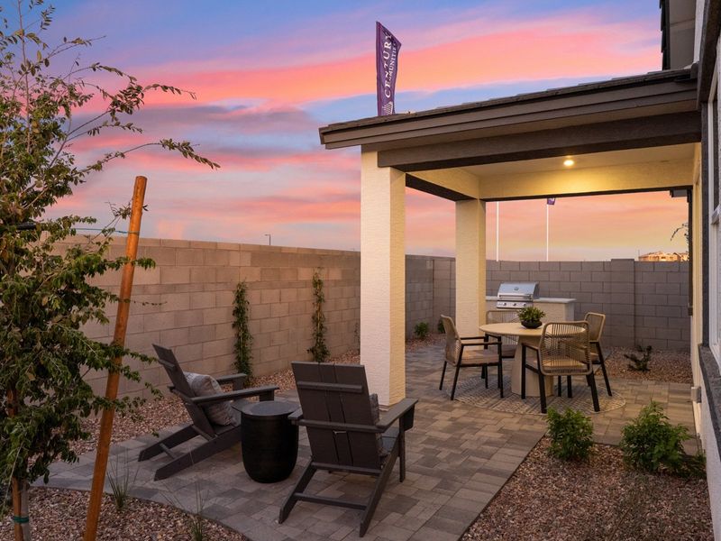A patio with a table and chairs.