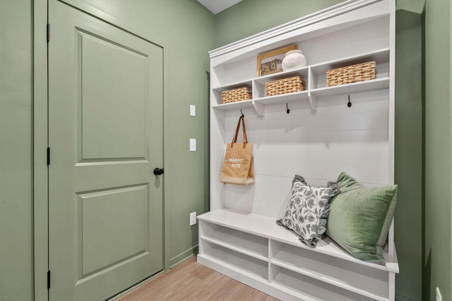 A white cabinet with a bag and a purse on it.