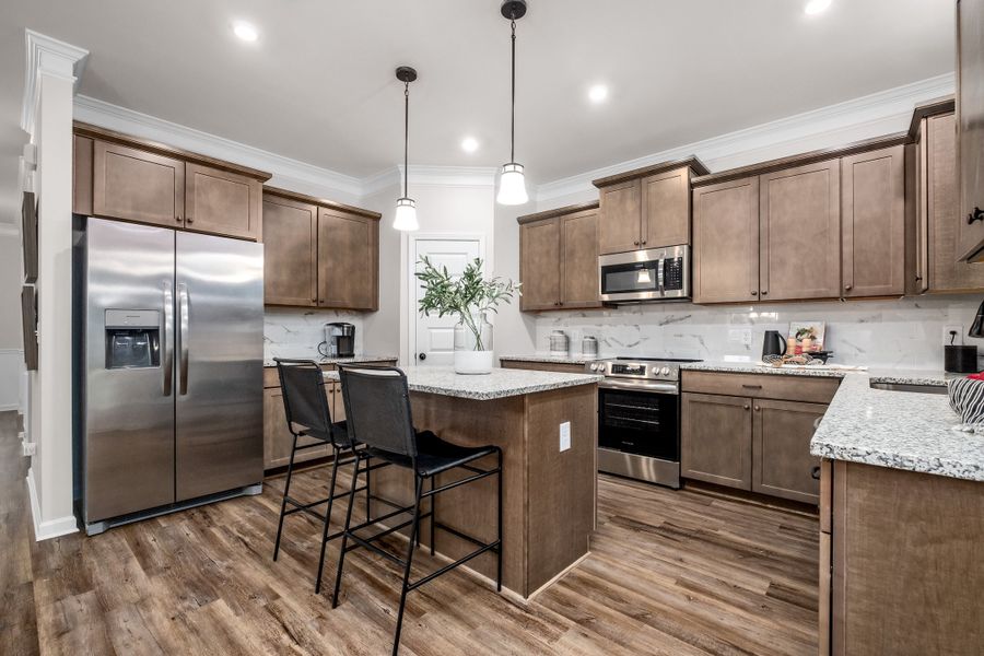 Furnished interior in a model home at Bryson Farms in Byron (Image 17).