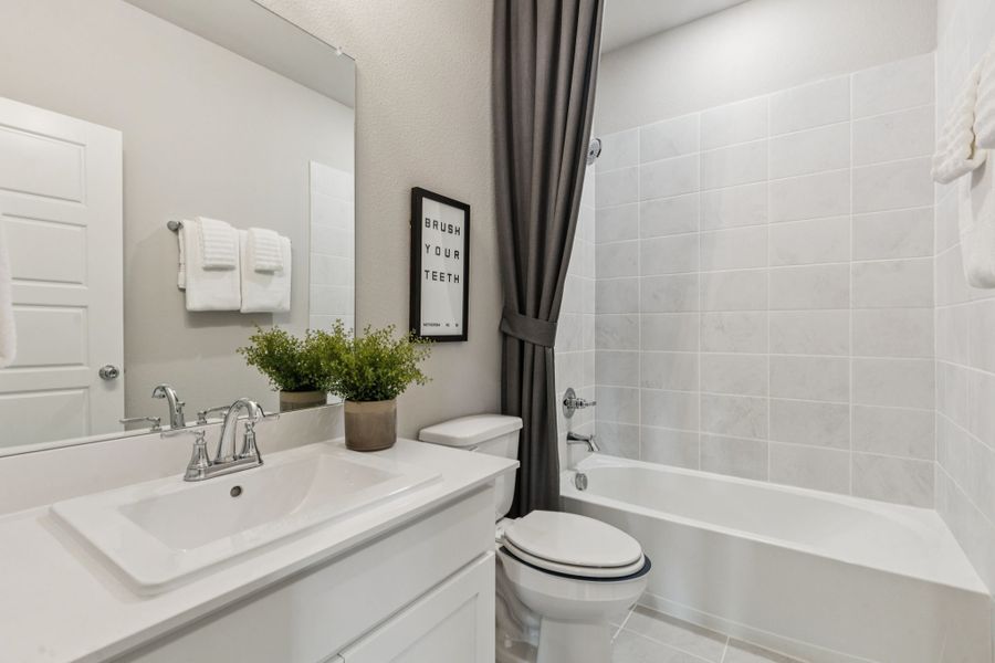 REPRESENTATIVE PHOTO – Bathroom in a Lakehaven Wimbledon model home in Farmersville TX by Trophy Signature Homes