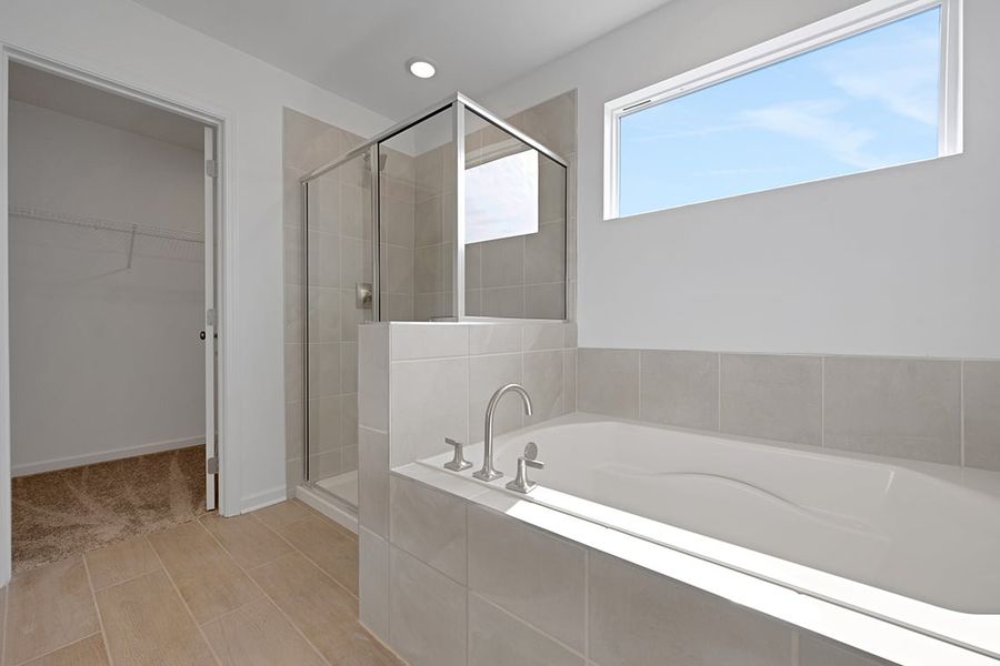 A bathroom with a glass shower. A bathroom with a glass shower.