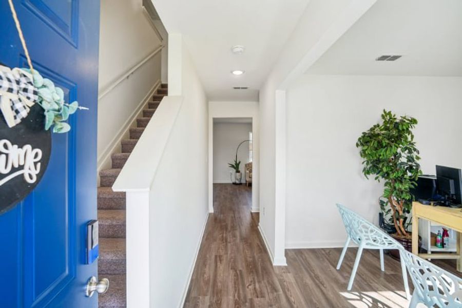 A room with a wood floor and white walls. A room with a wood floor and white walls.