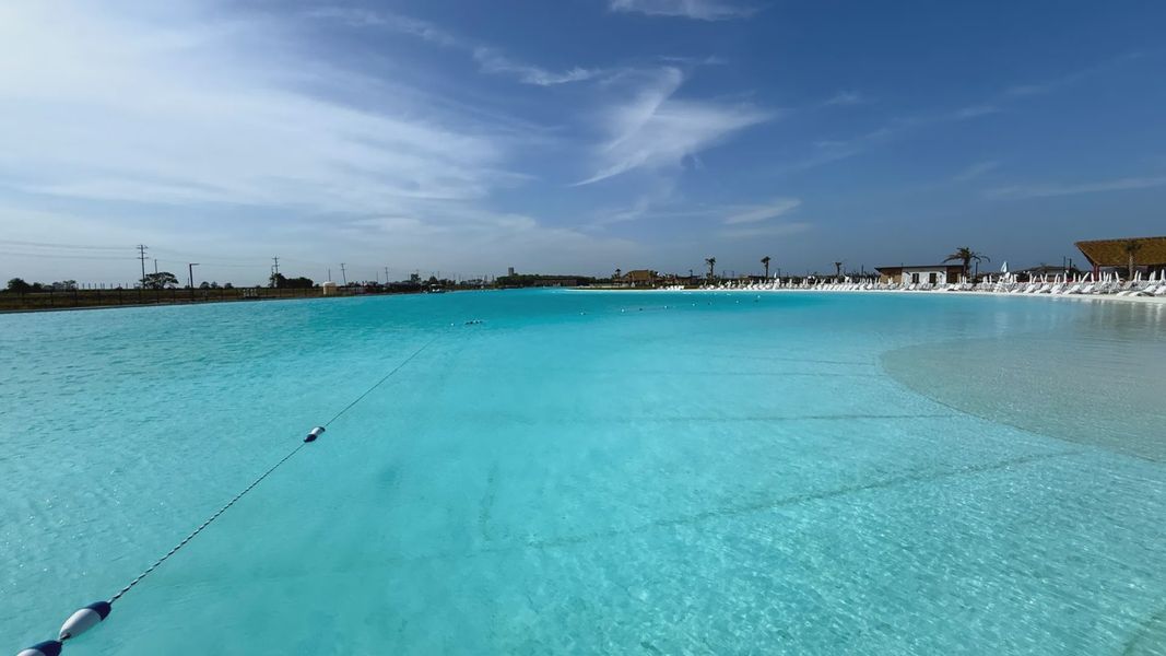 Experience opulent leisure by the pristine turquoise lagoon, complete with elegant loungers in River Ranch. Experience opulent leisure by the pristine turquoise lagoon, complete with elegant loungers in River Ranch.