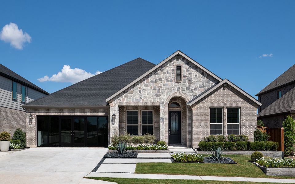 Front exterior of a home in the View at the Reserve 60s community, located in Mansfield, TX (Image 5).
