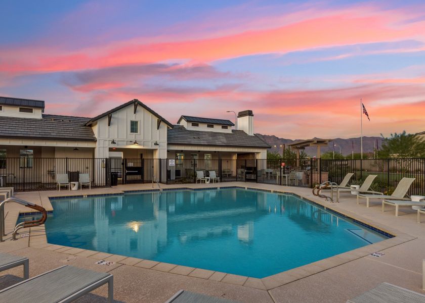 A swimming pool in a backyard. A swimming pool in a backyard.