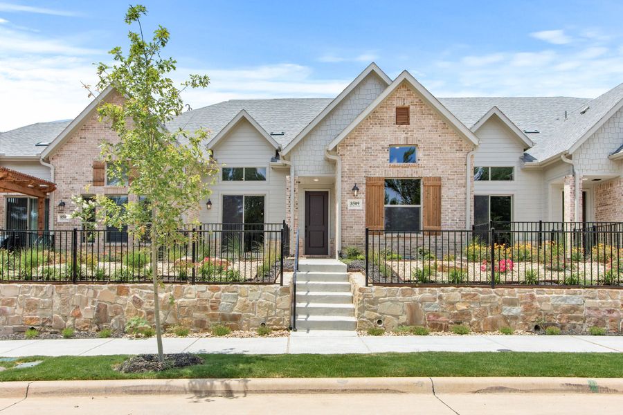 Front exterior of a home in the Cottonwood Creek community, located in Rowlett, TX (Image 2).