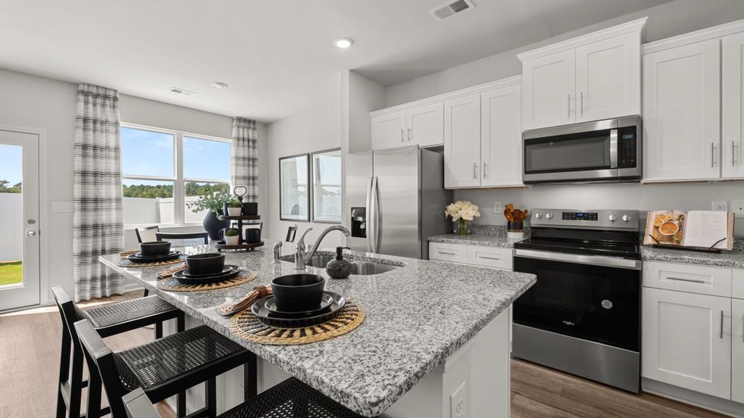 Furnished interior in a model home at Rushing Waters Townhomes in North Augusta (Image 5).