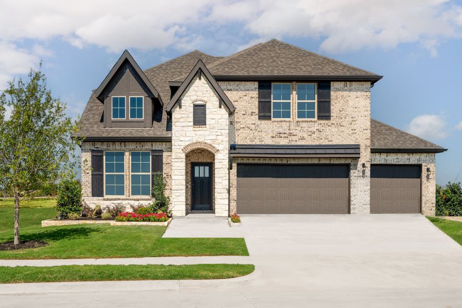 Front exterior of a home in the Woodcreek community, located in Fate, TX (Image 4).
