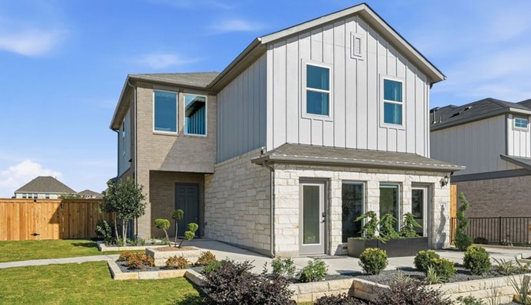 Front exterior of a home in the Sunfield community, located in Mustang Ridge, TX (Image 4). Front exterior of a home in the Sunfield community, located in Mustang Ridge, TX (Image 4).