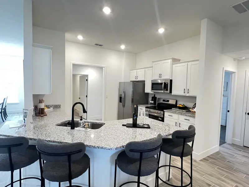 Furnished interior in a model home at Hill Country Estates in Dade City (Image 3).