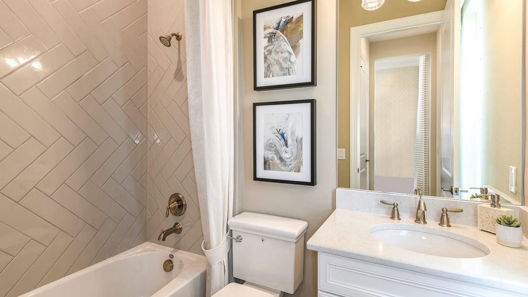 Furnished interior in a model home at Esplanade by the Islands in Naples (Image 34).