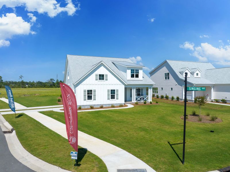 Front exterior of a home in the Songbird community, located in Hampstead, NC (Image 8). Front exterior of a home in the Songbird community, located in Hampstead, NC (Image 8).