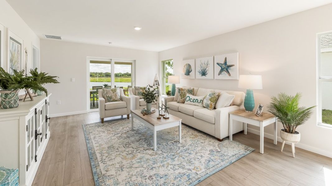 Furnished interior in a model home at Cali Cove in Punta Gorda (Image 18).