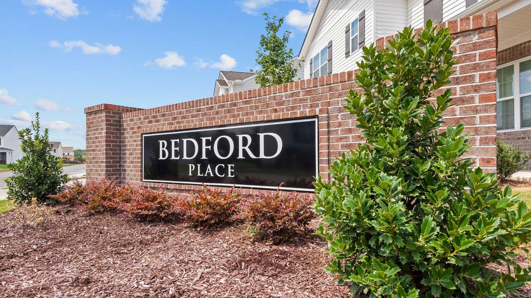 Entrance to the Bedford Place community in Wilson, NC, featuring signage and landscaping (Image 1).