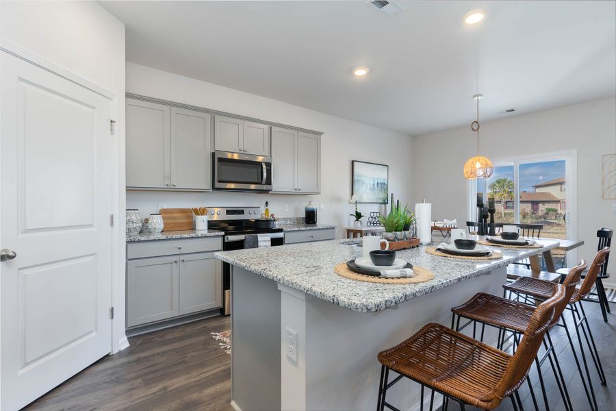 Furnished interior in a model home at Island Green in Myrtle Beach (Image 10).