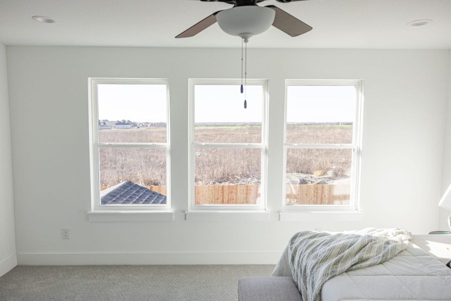 Furnished interior in a model home at Callan Village in San Antonio (Image 24).