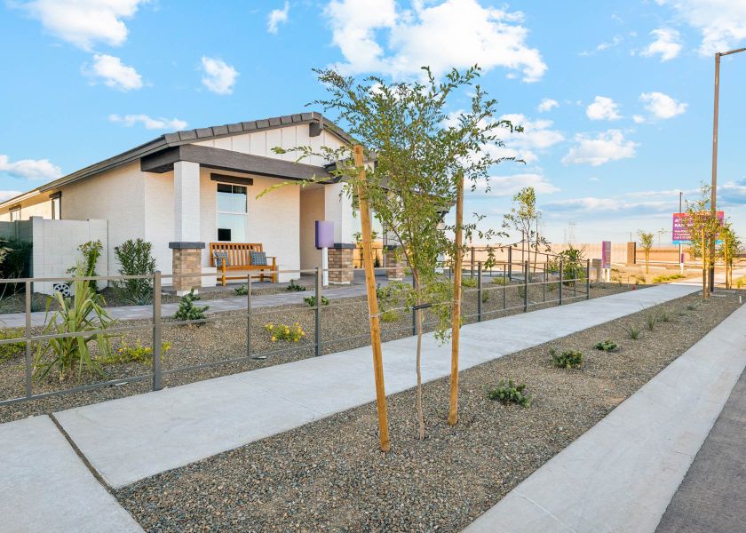 A building with a fence and trees.