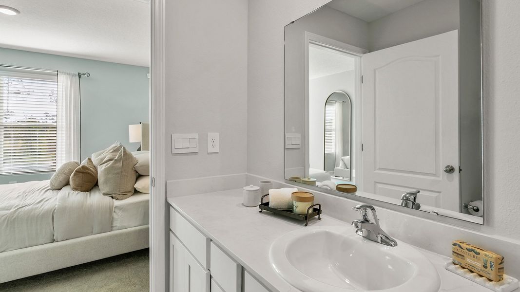 Furnished interior in a model home at Stokes Landing in St. Augustine (Image 18).