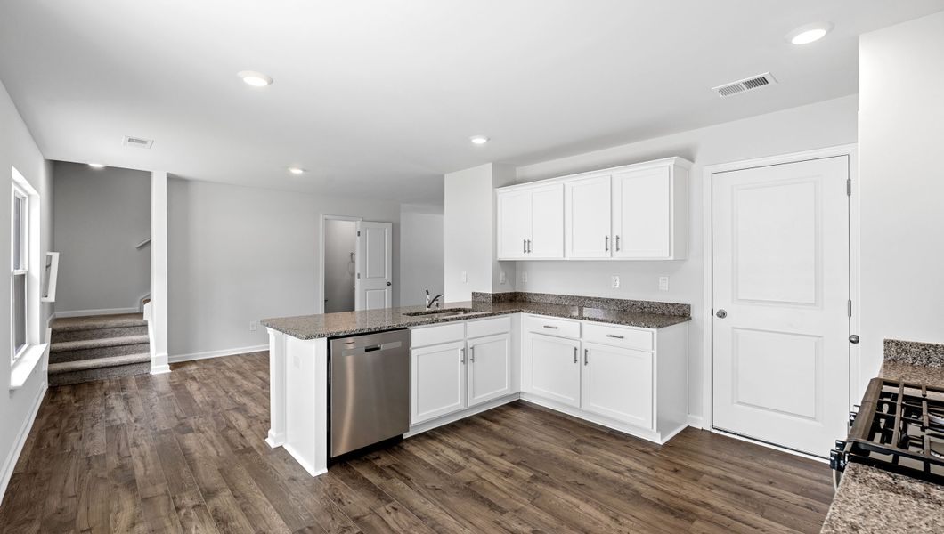 Furnished interior in a model home at Village Grove in Greenville (Image 7).