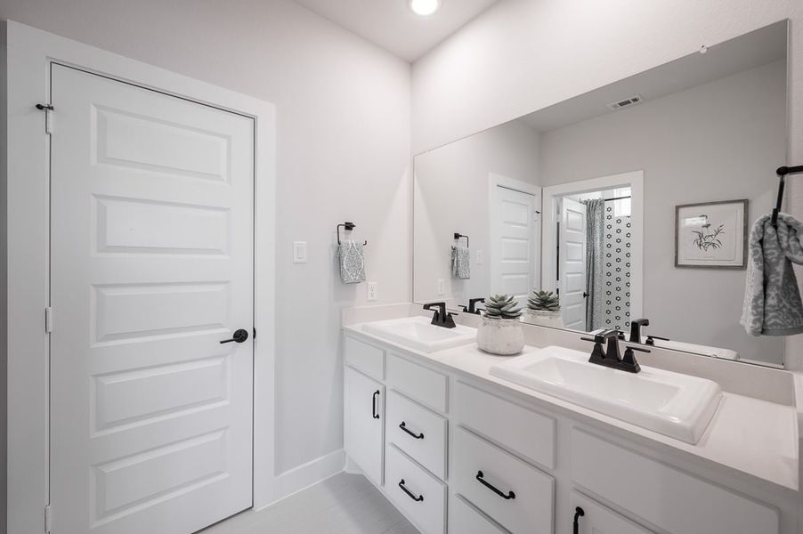 Furnished interior in a model home at Sienna 60’ in Missouri City (Image 32).