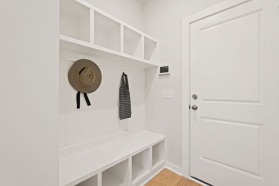 Functional mudroom with bench seating and cubbies keeps essentials organized and within easy reach