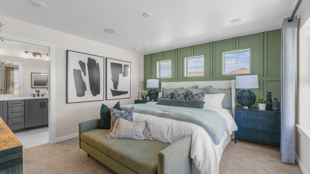 Luxurious Timnath Lakes bedroom features bespoke green accent wall and plush furnishings. Luxurious Timnath Lakes bedroom features bespoke green accent wall and plush furnishings.