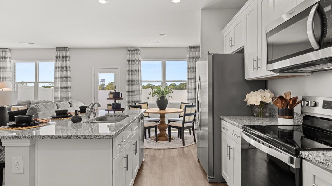 Furnished interior in a model home at Rushing Waters Townhomes in North Augusta (Image 6).