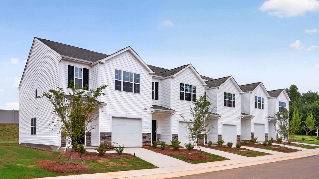 Front exterior of a home in the The Townes at Troutman community, located in Troutman, NC (Image 8). Front exterior of a home in the The Townes at Troutman community, located in Troutman, NC (Image 8).