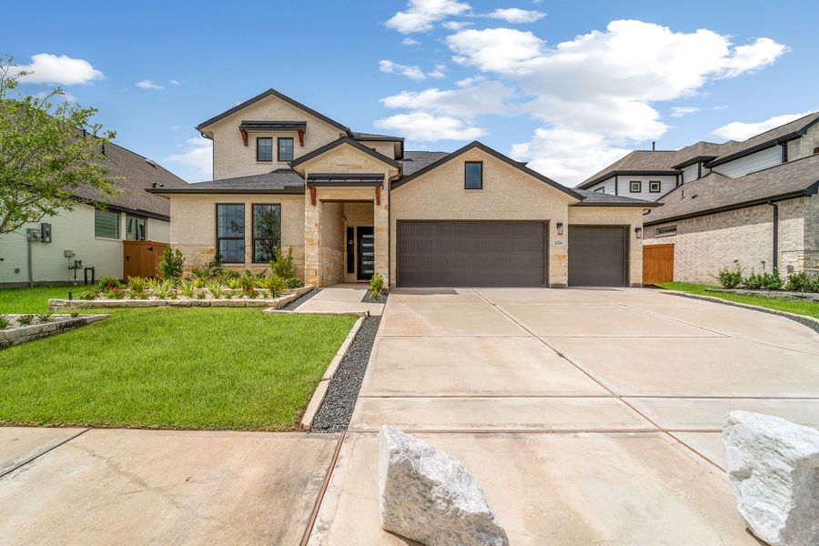 Front exterior of a home in the Sunterra community, located in Katy, TX (Image 3). Front exterior of a home in the Sunterra community, located in Katy, TX (Image 3).