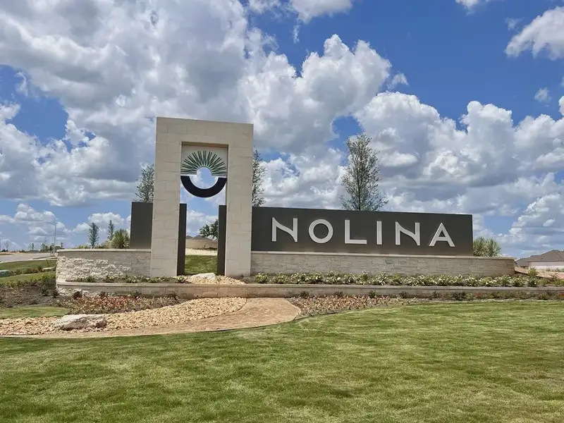 Entrance to the Nolina community in Georgetown, TX, featuring signage and landscaping (Image 2). Entrance to the Nolina community in Georgetown, TX, featuring signage and landscaping (Image 2).