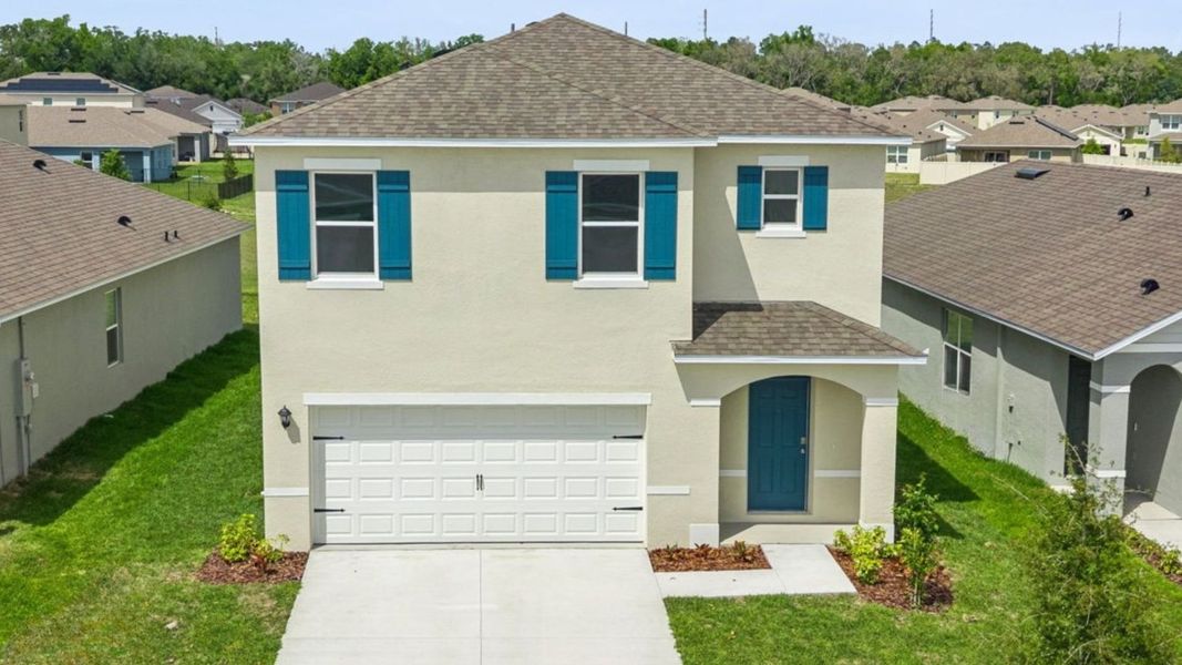 Front exterior of a home in the Wynwood community, located in Ocoee, FL (Image 5).