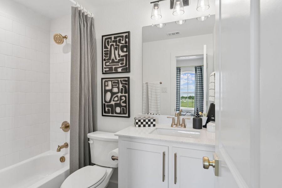 Furnished interior in a model home at Sweetgrass 65s in Haslet (Image 47).