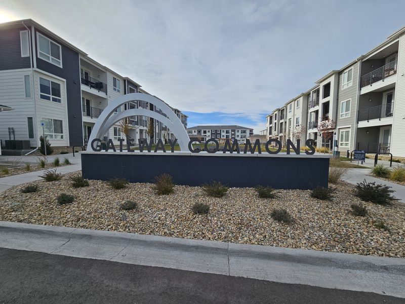 Entrance to the Gateway Commons community in Denver, CO, featuring signage and landscaping (Image 12). Entrance to the Gateway Commons community in Denver, CO, featuring signage and landscaping (Image 12).