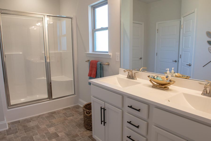Furnished interior in a model home at Hidden Lake Preserve in Greenville (Image 11).