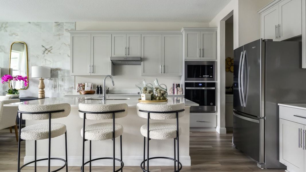 Furnished interior in a model home at Pasadena Woods in Dade City (Image 5).