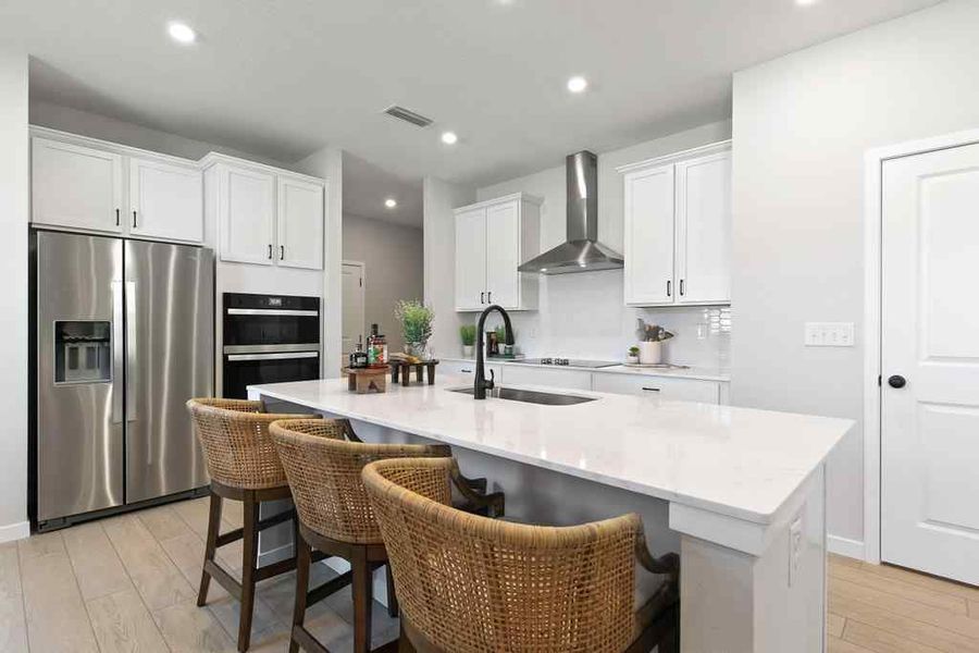 A kitchen with white cabinets. A kitchen with white cabinets.