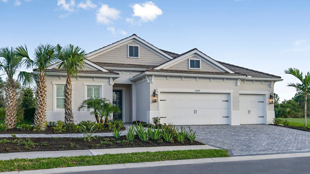 Front exterior of a home in the Avelina Real Estate and Homes for Sale in Venice, FL - Neal Communities community, located in Venice, FL (Image 2). Front exterior of a home in the Avelina Real Estate and Homes for Sale in Venice, FL - Neal Communities community, located in Venice, FL (Image 2).