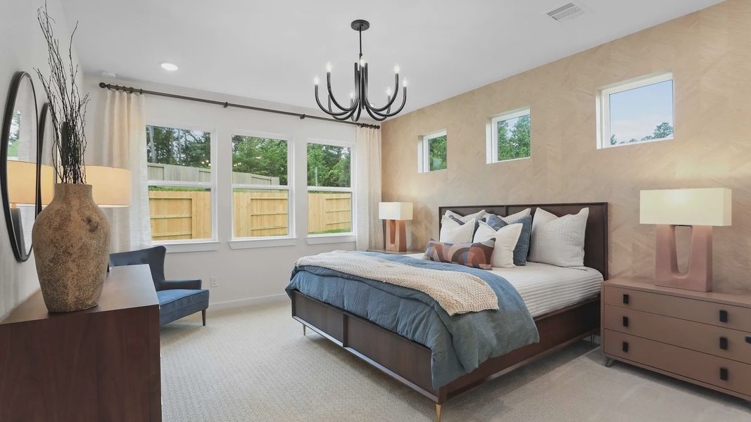 The Mostyn Springs bedroom features designer lighting, custom paneling, and serene views, epitomizing luxury living. The Mostyn Springs bedroom features designer lighting, custom paneling, and serene views, epitomizing luxury living.