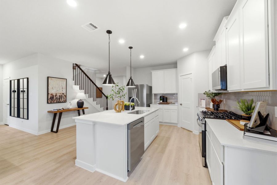 A kitchen with white cabinets. A kitchen with white cabinets.