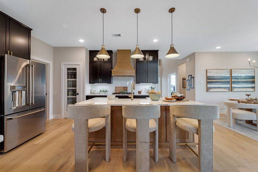 Furnished interior in a model home at Sunterra Lakes in Brookshire (Image 26).