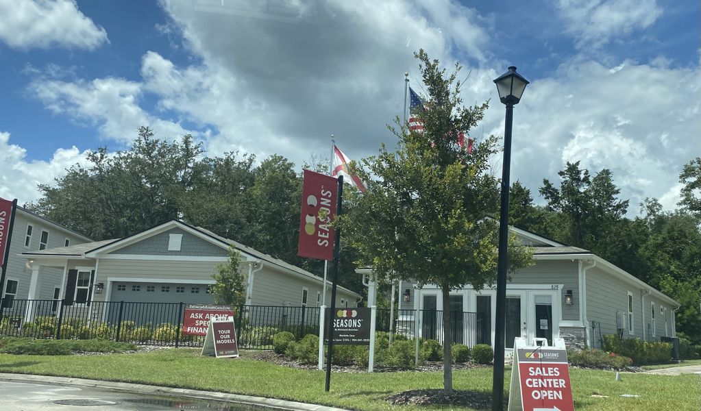 A charming sales center with lush landscaping in Seasons at Marietta Cove by Richmond American Homes (Jacksonville, FL).