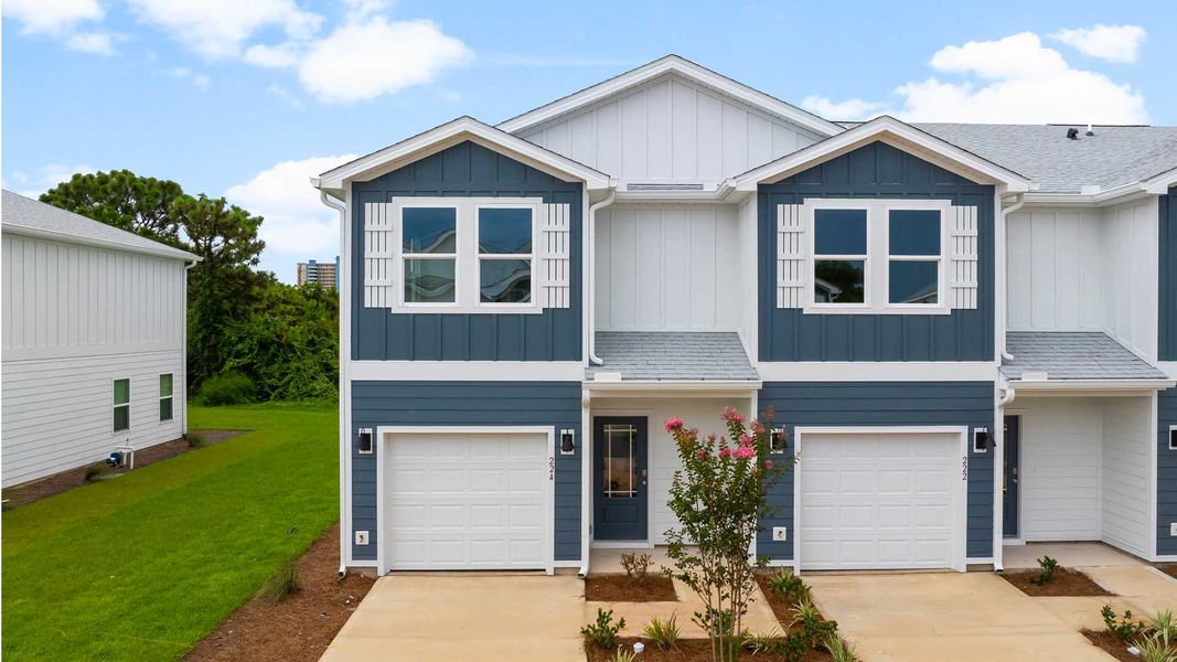 Front exterior of a home in the Caballeros Estates Townhomes at Hombre community, located in Panama City Beach, FL (Image 9).